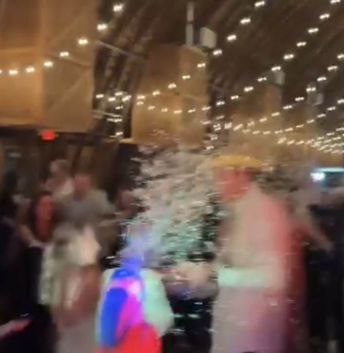 Confetti and celebration on the dance floor at the Knauss Wedding
